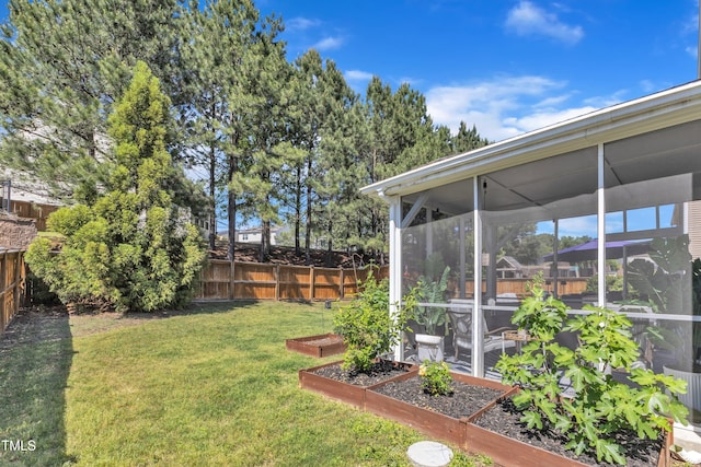 3801 Althorp Dr, Raleigh, NC 27616 - view of yard with a fenced backyard, a sunroom, and a vegetable garden