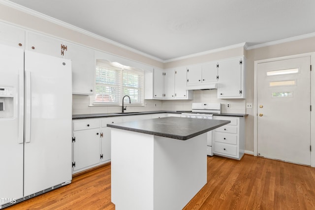 2917 Trail Six, Burlington, NC 27215 - kitchen featuring white appliances, a sink, dark countertops, ornamental molding, and light wood-type flooring