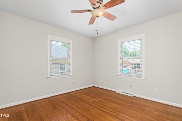 2917 Trail Six, Burlington, NC 27215 - empty room with baseboards, plenty of natural light, and wood finished floors
