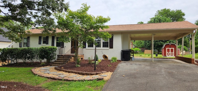 2917 Trail Six, Burlington, NC 27215 - single story home with asphalt driveway, a carport, and brick siding