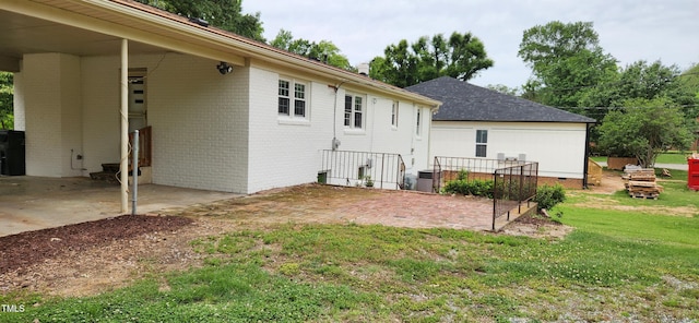2917 Trail Six, Burlington, NC 27215 - rear view of property with a lawn and brick siding