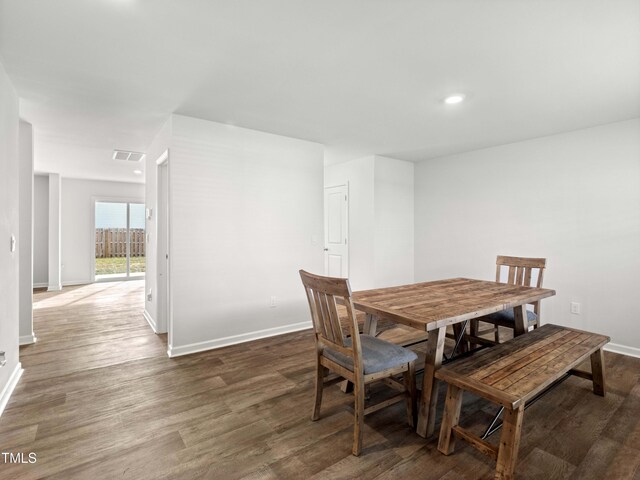 6858 Keeneland Dr, Whitsett, NC 27377 - dining space featuring recessed lighting, baseboards, visible vents, and wood finished floors