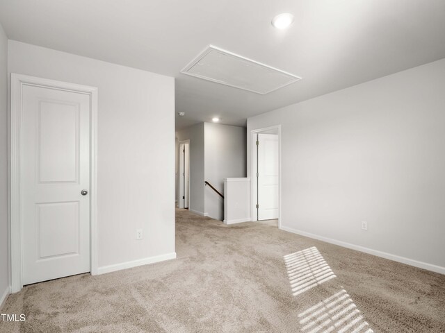 6858 Keeneland Dr, Whitsett, NC 27377 - unfurnished room featuring baseboards, attic access, carpet, and recessed lighting