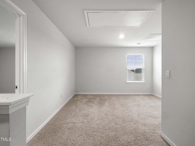 6858 Keeneland Dr, Whitsett, NC 27377 - empty room with baseboards, light carpet, and attic access