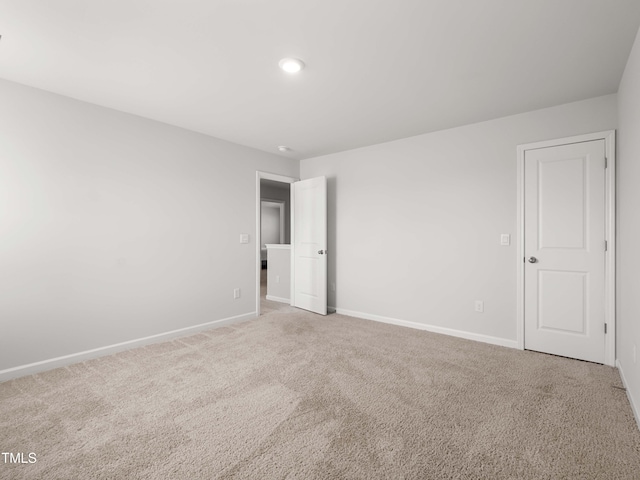 6858 Keeneland Dr, Whitsett, NC 27377 - unfurnished bedroom featuring baseboards, carpet, and recessed lighting