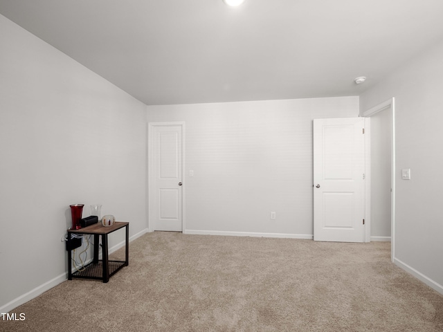 6858 Keeneland Dr, Whitsett, NC 27377 - carpeted empty room with baseboards