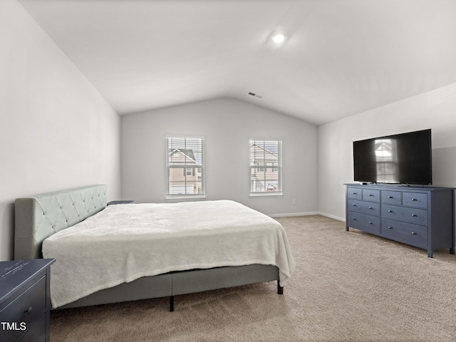 6858 Keeneland Dr, Whitsett, NC 27377 - bedroom with lofted ceiling, light colored carpet, and visible vents