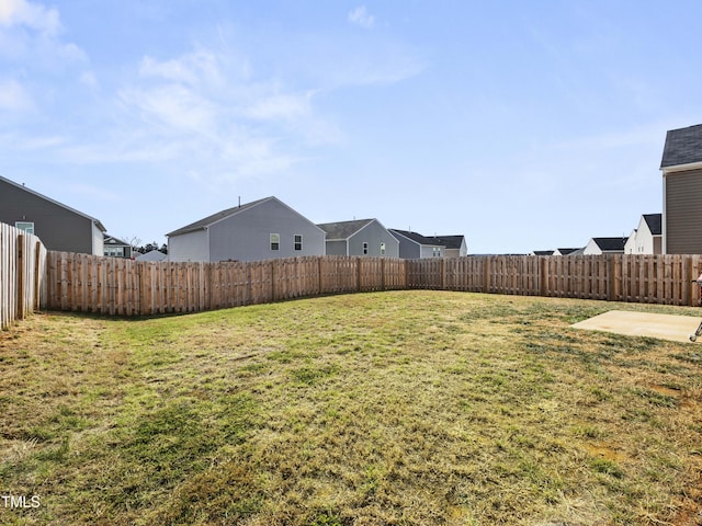 6858 Keeneland Dr, Whitsett, NC 27377 - view of yard featuring a fenced backyard
