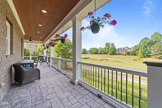 view of patio / terrace featuring ceiling fan and golf course view
