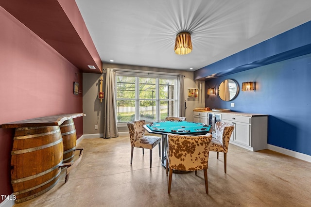 rec room with finished concrete floors, recessed lighting, and baseboards