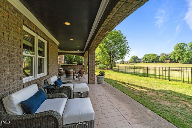 view of patio with outdoor lounge area and a fenced backyard