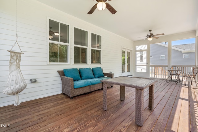 wooden terrace featuring ceiling fan and outdoor lounge area