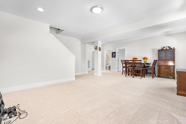 dining area with light colored carpet, recessed lighting, and baseboards