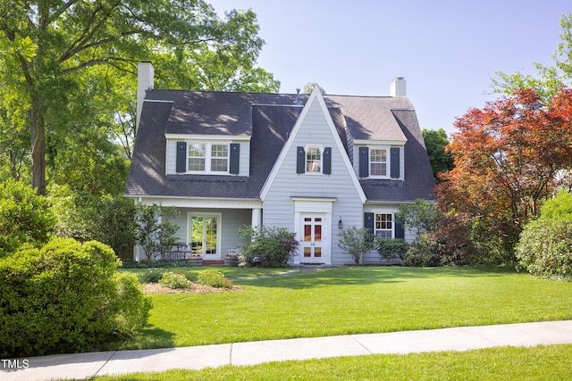 19 Oak Dr, Durham, NC 27707 - view of front of property featuring french doors, a chimney, and a front lawn