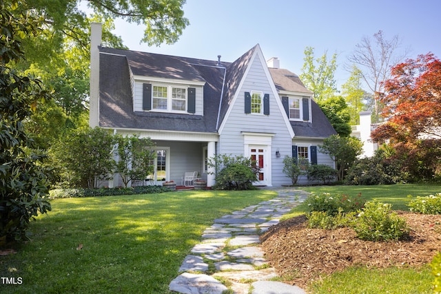 19 Oak Dr, Durham, NC 27707 - view of front of home featuring roof with shingles, a front yard, and a chimney