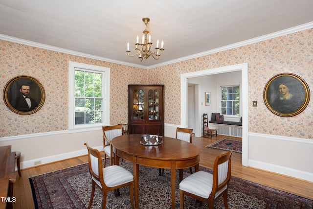 19 Oak Dr, Durham, NC 27707 - dining room with wallpapered walls, wood finished floors, and a notable chandelier