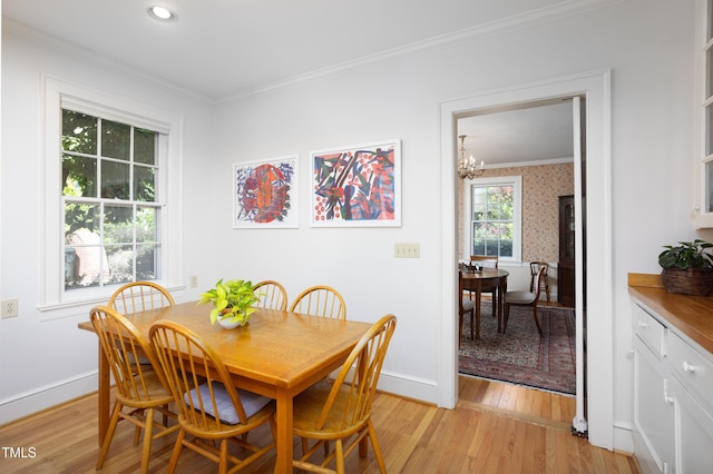 19 Oak Dr, Durham, NC 27707 - dining room featuring crown molding, baseboards, a notable chandelier, and light wood-style floors