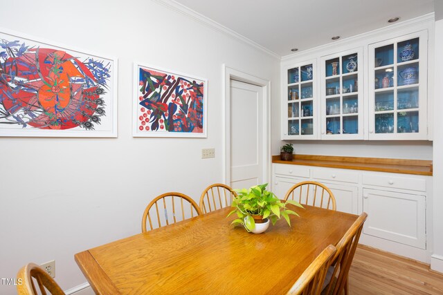 19 Oak Dr, Durham, NC 27707 - dining room featuring crown molding and light wood finished floors