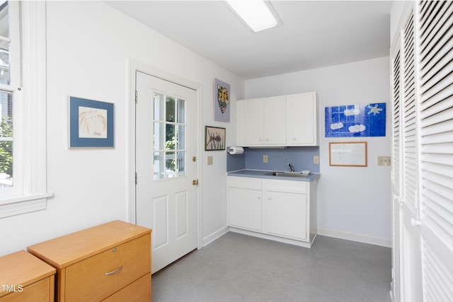 19 Oak Dr, Durham, NC 27707 - laundry area with baseboards and a sink
