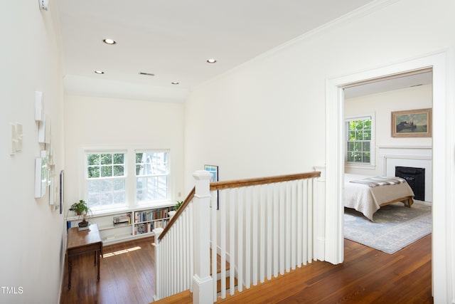 19 Oak Dr, Durham, NC 27707 - hallway featuring wood-type flooring, visible vents, ornamental molding, recessed lighting, and an upstairs landing