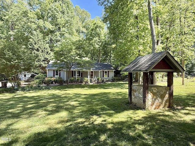 exterior space with a porch, a front lawn, and stone siding