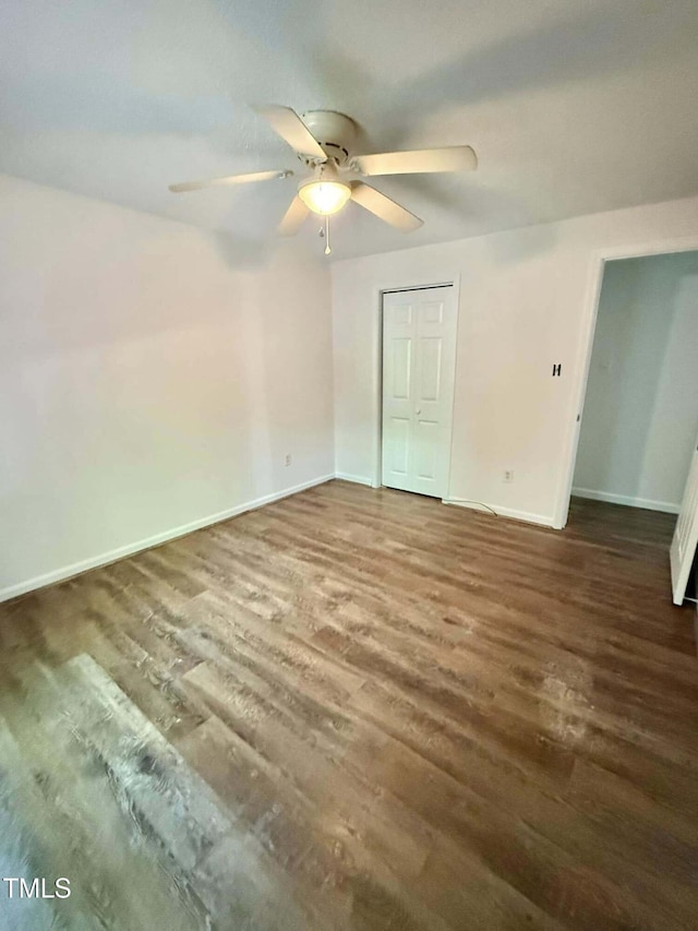 unfurnished bedroom with baseboards, ceiling fan, and wood finished floors