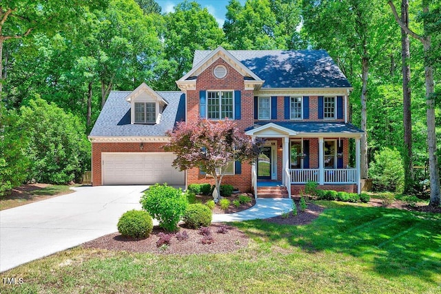 105 Wittenham Dr, Cary, NC 27519 - view of front of property with a porch, driveway, brick siding, and a garage