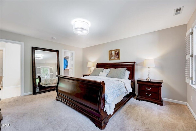 105 Wittenham Dr, Cary, NC 27519 - bedroom featuring light carpet, a walk in closet, and baseboards