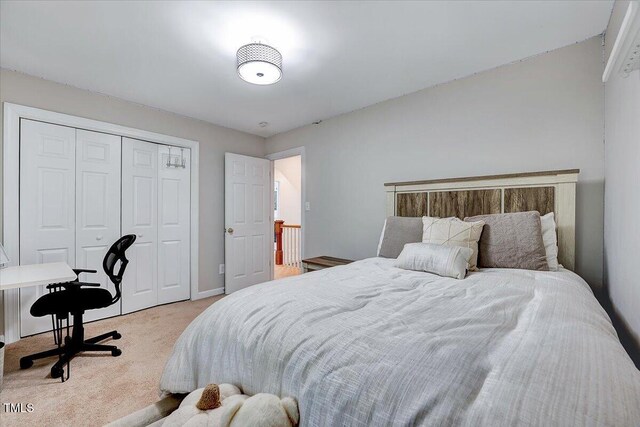 105 Wittenham Dr, Cary, NC 27519 - bedroom with light colored carpet, a closet, and baseboards