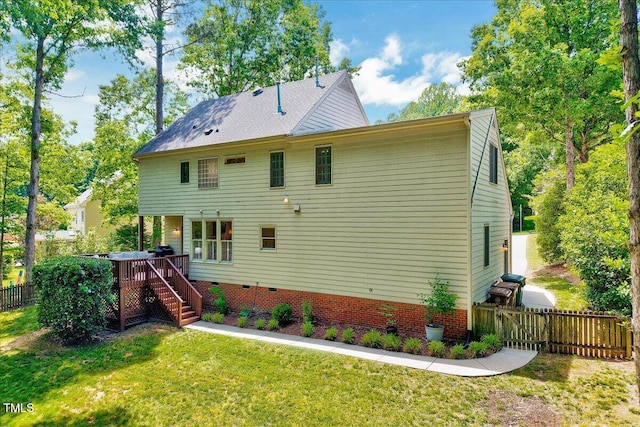 105 Wittenham Dr, Cary, NC 27519 - back of property with crawl space, stairway, and a wooden deck