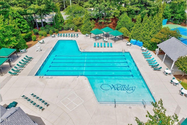 105 Wittenham Dr, Cary, NC 27519 - community pool featuring a patio and view of wooded area