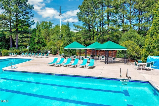 105 Wittenham Dr, Cary, NC 27519 - community pool with a patio, view of scattered trees, and fence