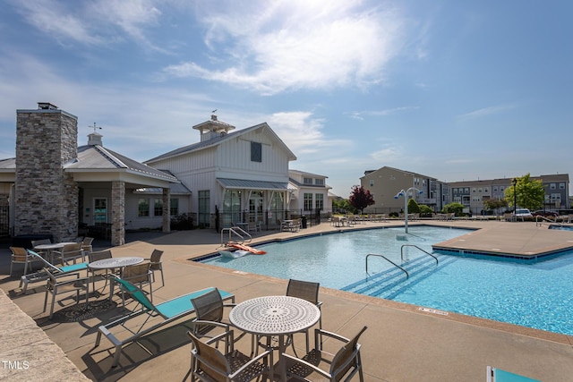 pool featuring a patio area