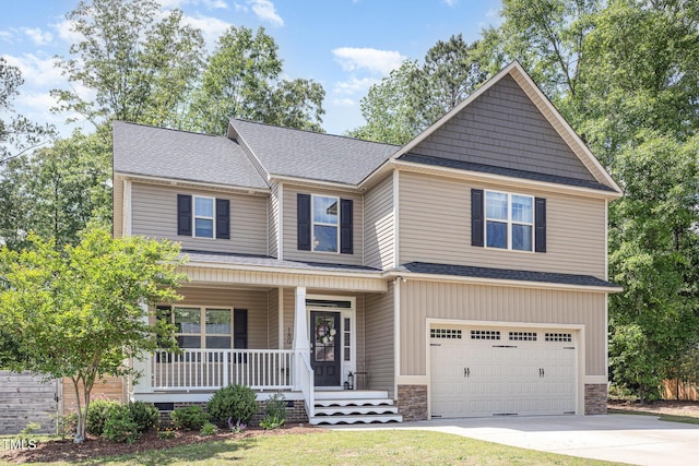 180 Long Grass Dr, Smithfield, NC 27577 - craftsman house featuring covered porch, stone siding, roof with shingles, concrete driveway, and an attached garage