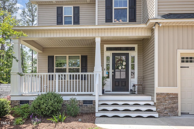 180 Long Grass Dr, Smithfield, NC 27577 - doorway to property with covered porch, board and batten siding, and stone siding