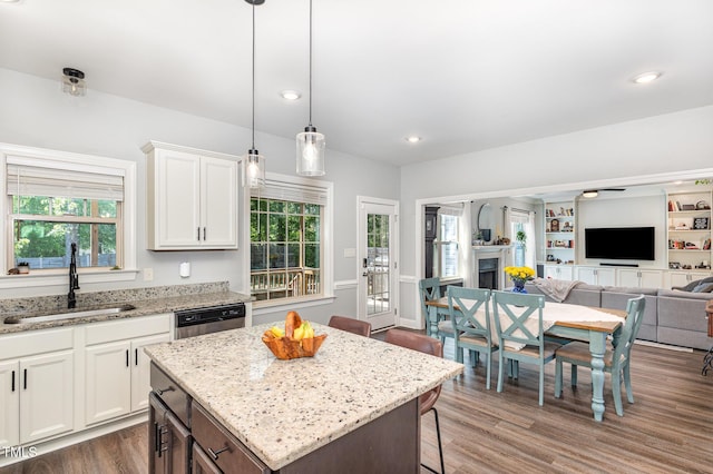 180 Long Grass Dr, Smithfield, NC 27577 - kitchen with a kitchen breakfast bar, dishwasher, a sink, white cabinets, and open floor plan