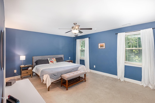 180 Long Grass Dr, Smithfield, NC 27577 - bedroom with baseboards, multiple windows, light carpet, and ceiling fan