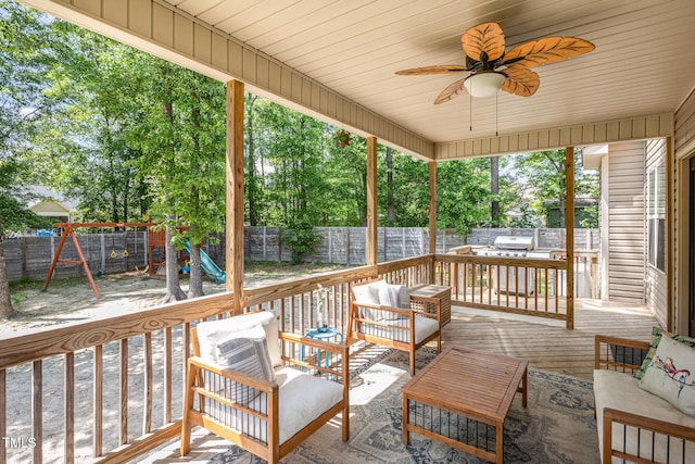 180 Long Grass Dr, Smithfield, NC 27577 - deck with outdoor lounge area, a ceiling fan, a fenced backyard, and a playground