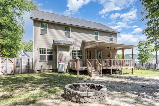 180 Long Grass Dr, Smithfield, NC 27577 - rear view of property with a fire pit, fence, a yard, and a deck