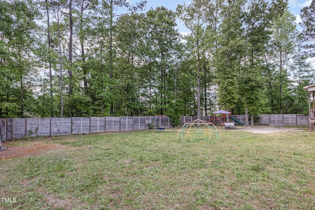 180 Long Grass Dr, Smithfield, NC 27577 - view of yard featuring a playground and a fenced backyard