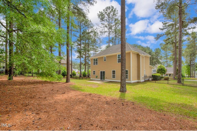 view of home's exterior featuring fence, a patio, and a yard