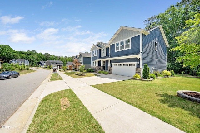 view of front of home with a garage, a front yard, stone siding, concrete driveway, and a residential view