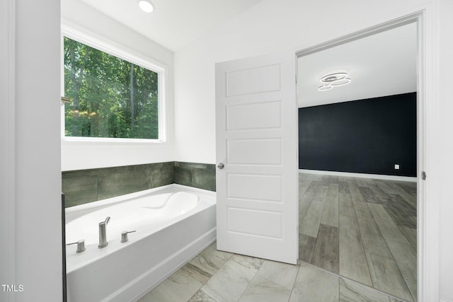 full bath featuring a bath