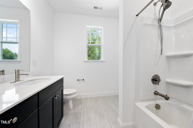 full bathroom featuring bathtub / shower combination, vanity, toilet, baseboards, and visible vents