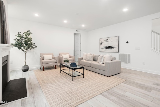 1813 Lost Creek Ct, Apex, NC 27539 - living room with light wood-style flooring, baseboards, recessed lighting, and a fireplace