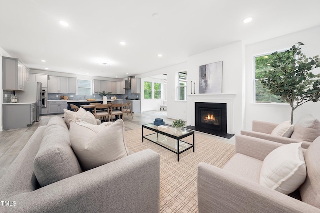 1813 Lost Creek Ct, Apex, NC 27539 - living room featuring recessed lighting and a glass covered fireplace