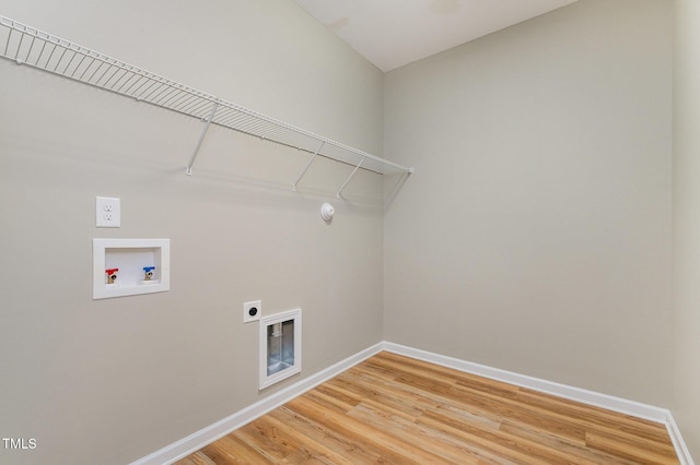 washroom featuring hookup for an electric dryer, laundry area, baseboards, and hookup for a washing machine