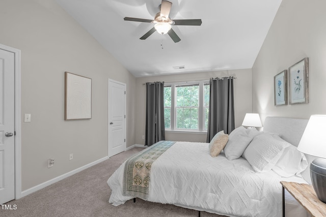 bedroom featuring carpet flooring, visible vents, a ceiling fan, baseboards, and vaulted ceiling
