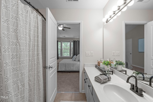 ensuite bathroom featuring connected bathroom, visible vents, tile patterned flooring, and vanity