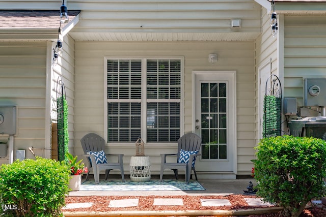 entrance to property featuring a patio